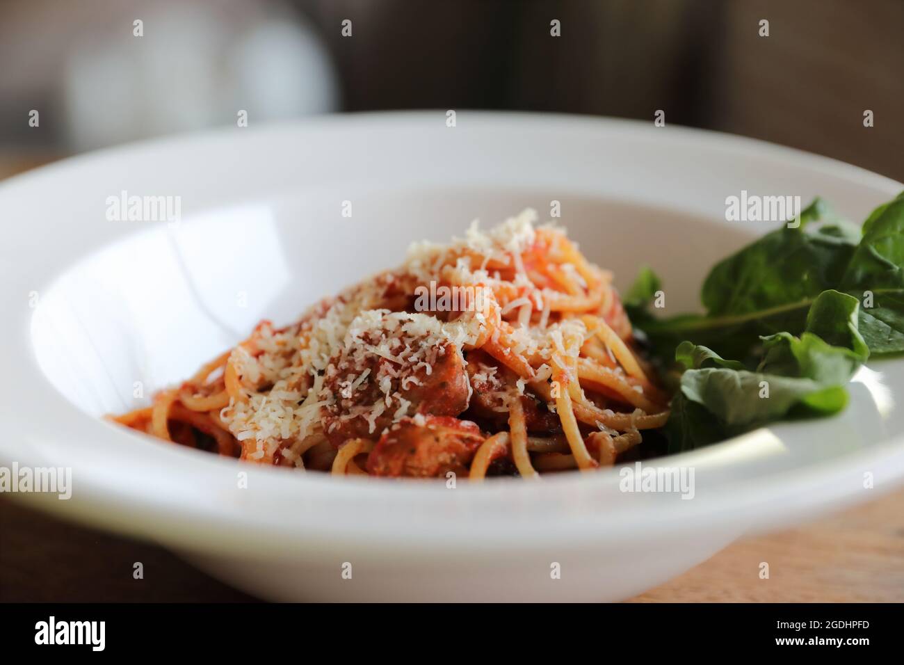 spaghetti Bolognese with italian sausage and tomato sauce with parmesan