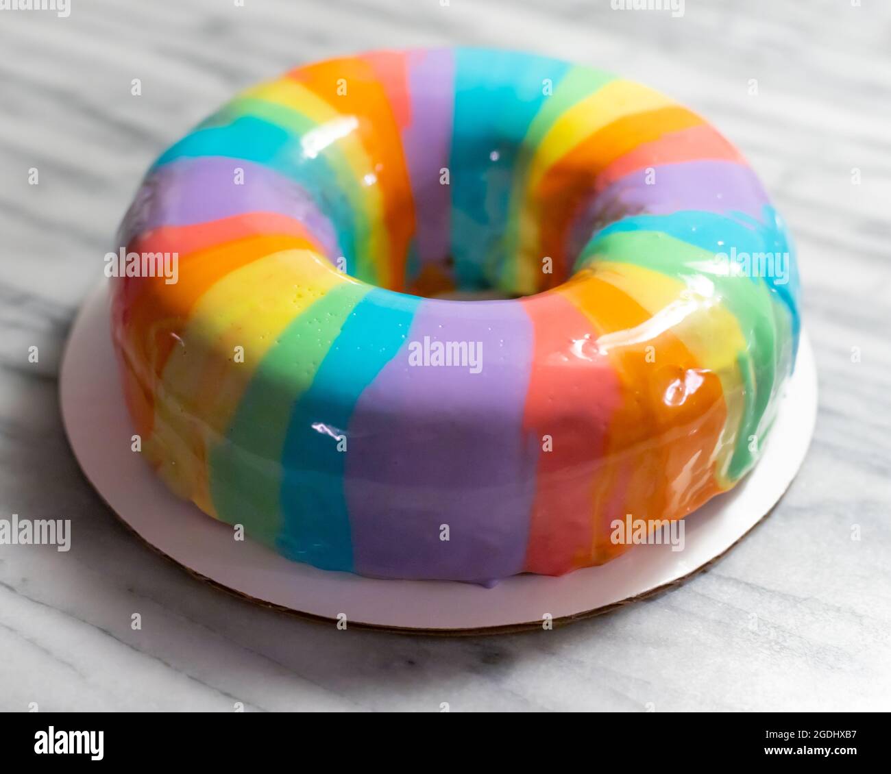 rainbow mirror glaze ring cake Stock Photo