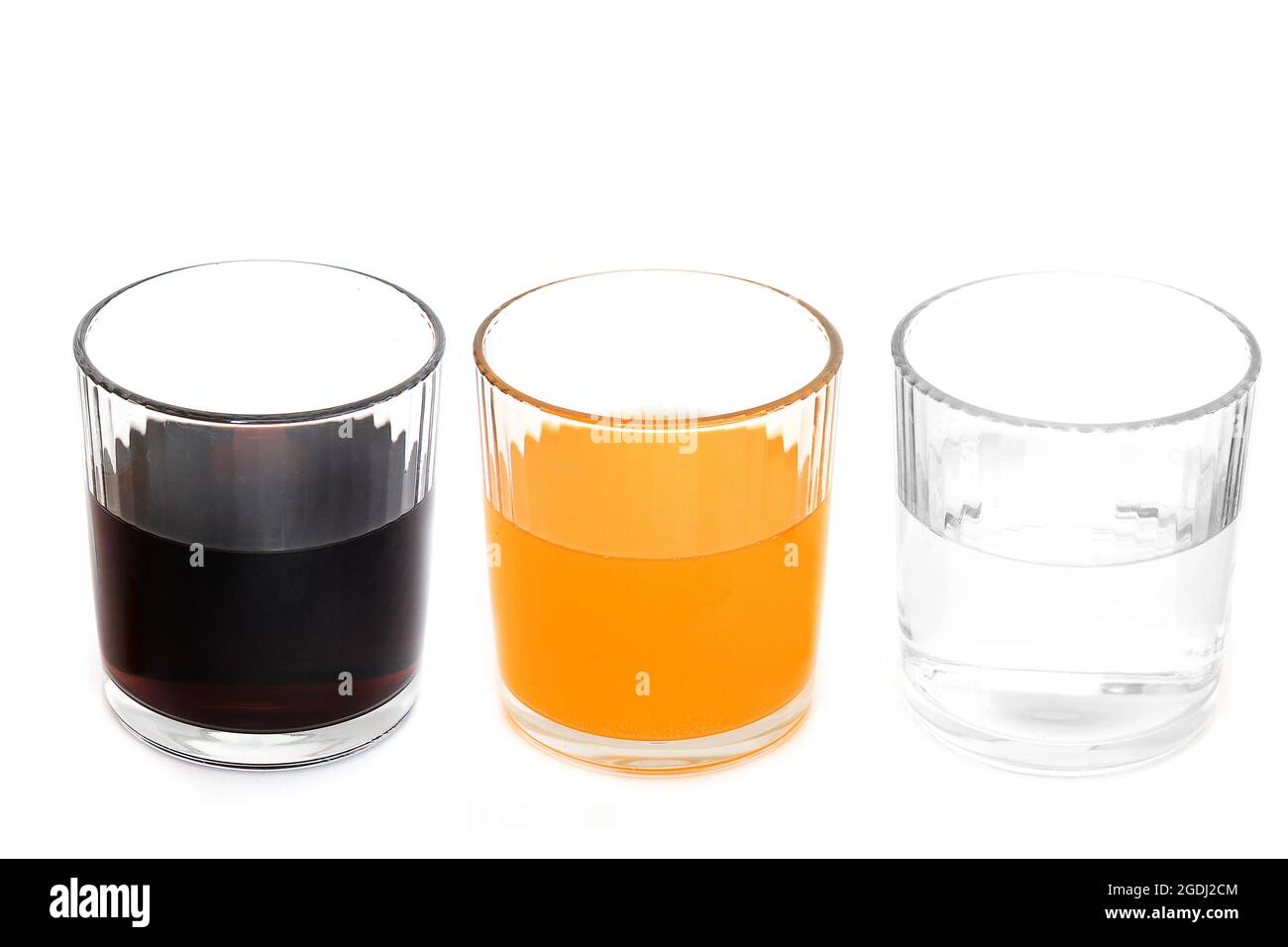 A healthy drink. A harmful drink. Drinks on a white background. Water. Fanta. Cola Stock Photo