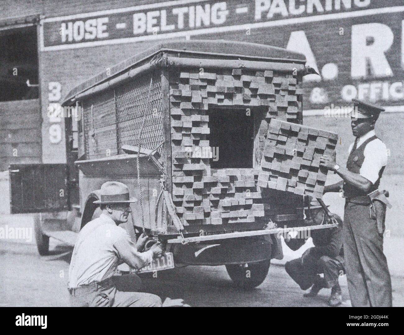 Smugglers disguised as planks transport alcoholic beverages in the United States in the 1920s. Stock Photo