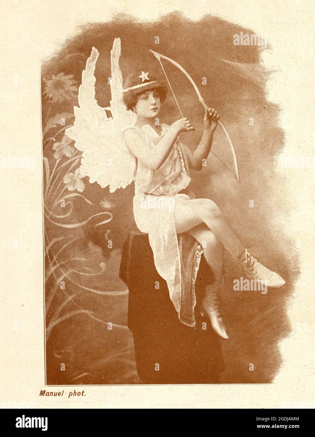 Belle Epoque era actress in a Angel, Cupid, Fairy costume, Beautiful woman holding a bow, wearing wings Stock Photo