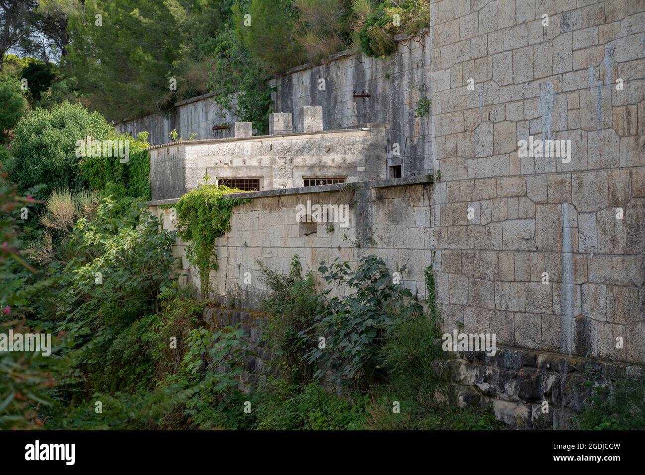 Overgrown outer walls of Fort Stoja, former Austro-Hungarian fortification from 1884 in Stoja camp in Pula (Croatia). Stock Photo