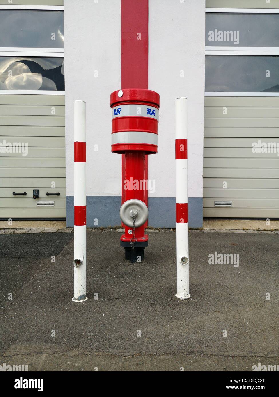 a fire hydrant in front of a building Stock Photo - Alamy