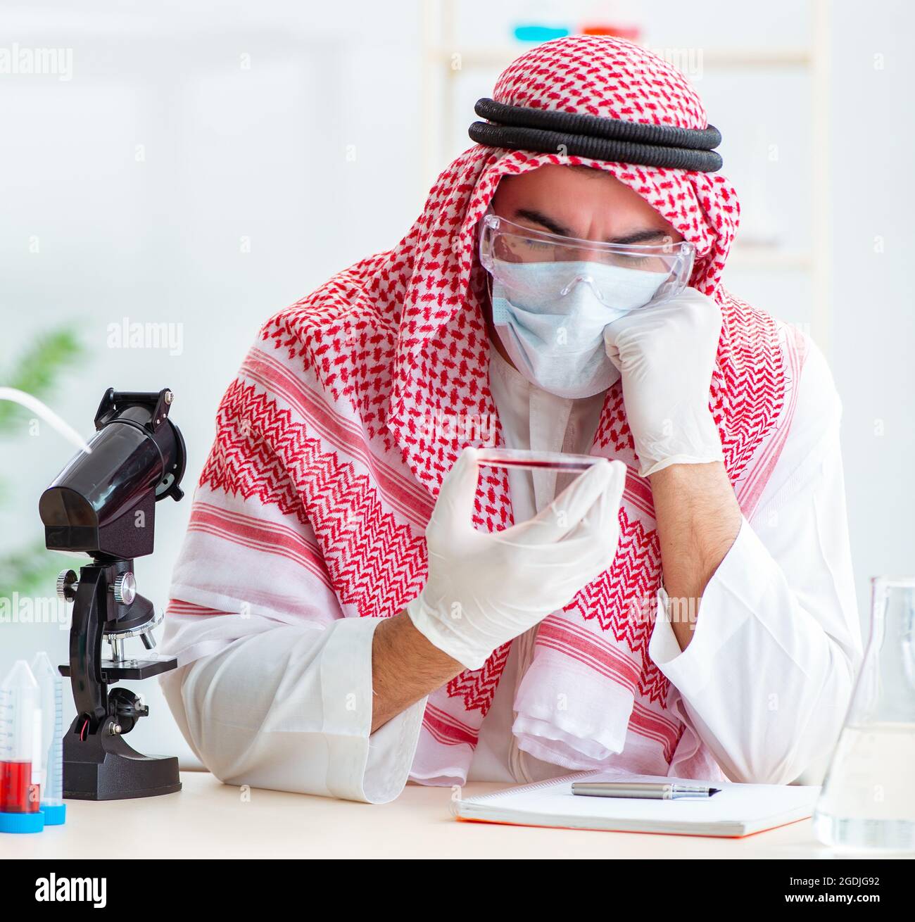 The arab doctor chemist studying new virus in lab Stock Photo