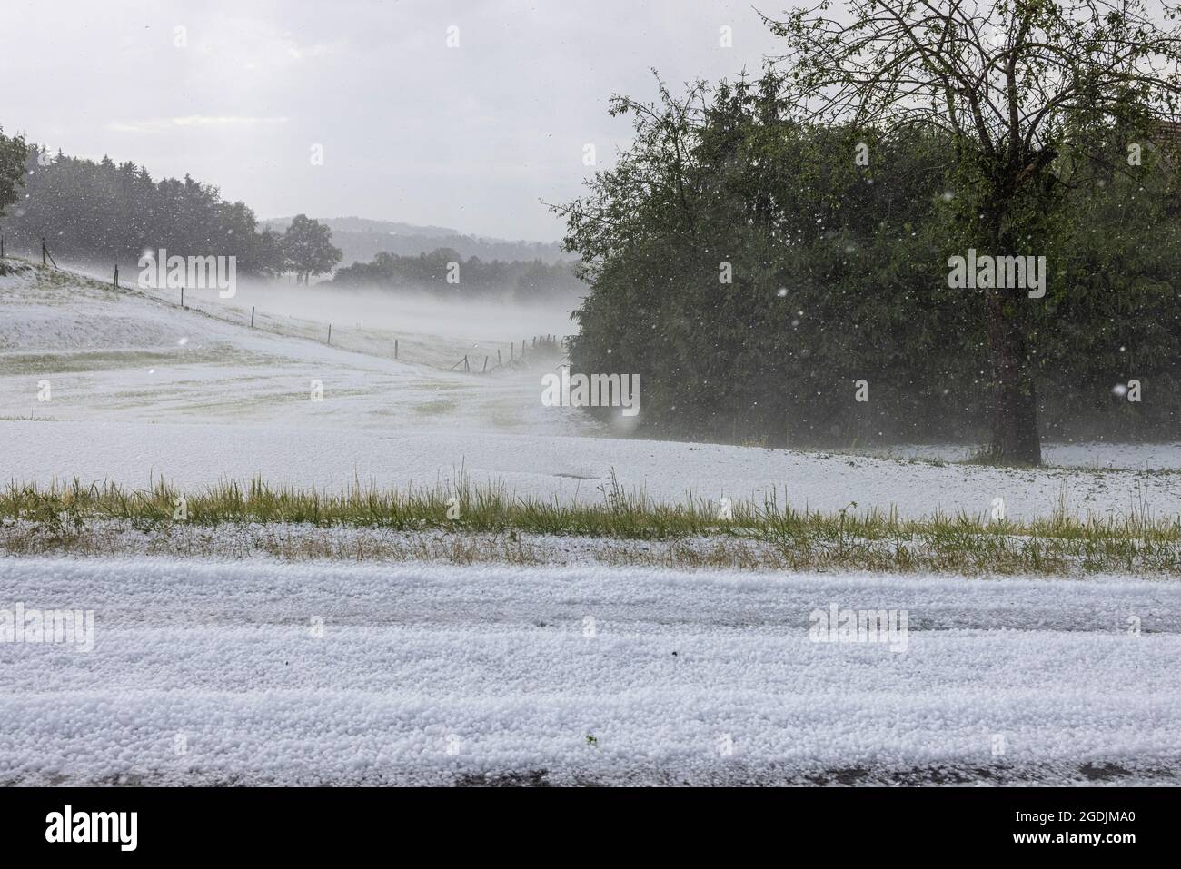 hail covers country road 15, wintry conditions, Germany, Bavaria, Haag Stock Photo