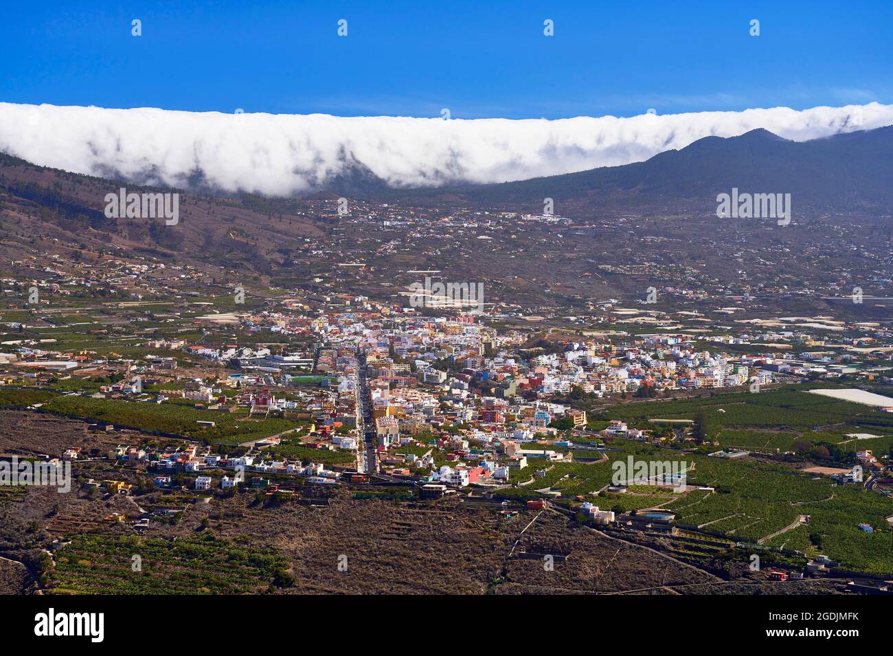 Trade wind clouds top the northern edge of the Caldera de Taburiente ...