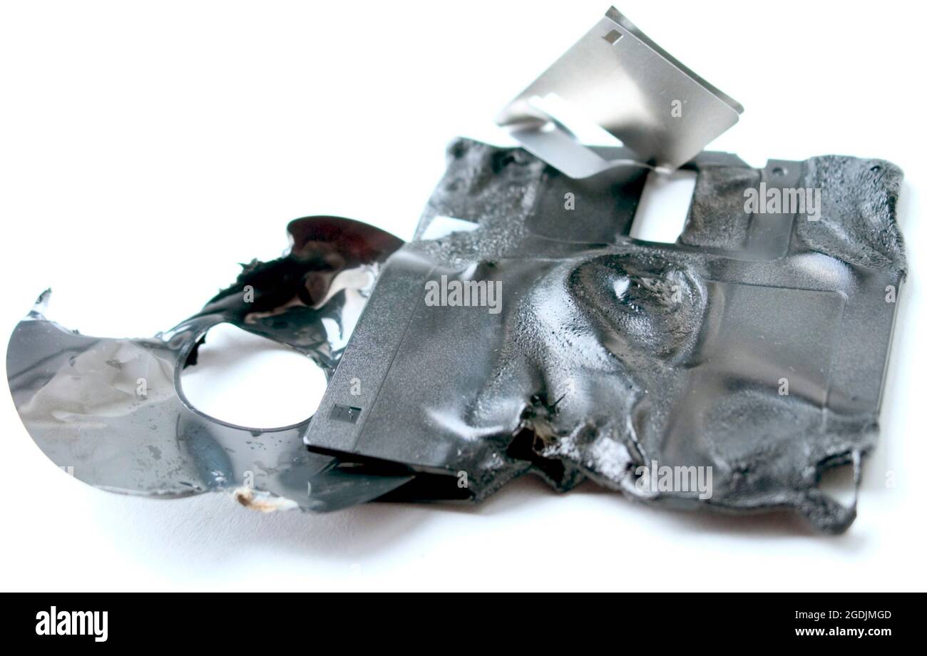 loss of data, melted CD and diskette Stock Photo - Alamy