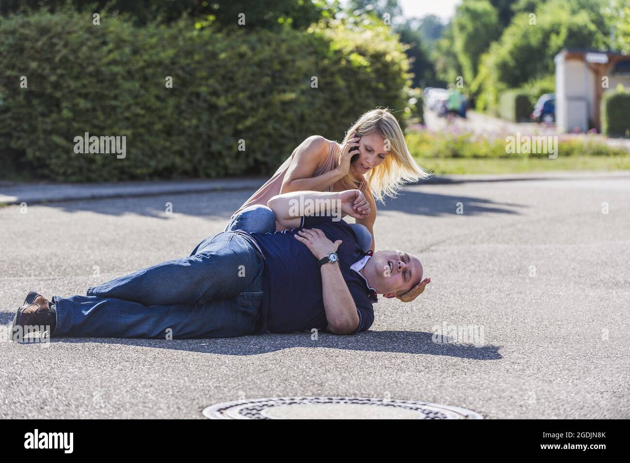 man with heart attack receiving first aid , Germany Stock Photo