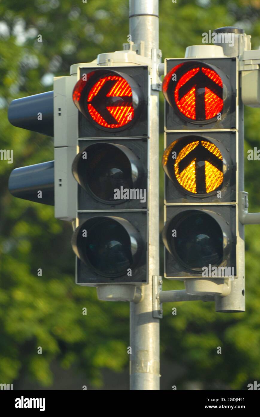 two red traffic lights for leftturning drivers and straight on