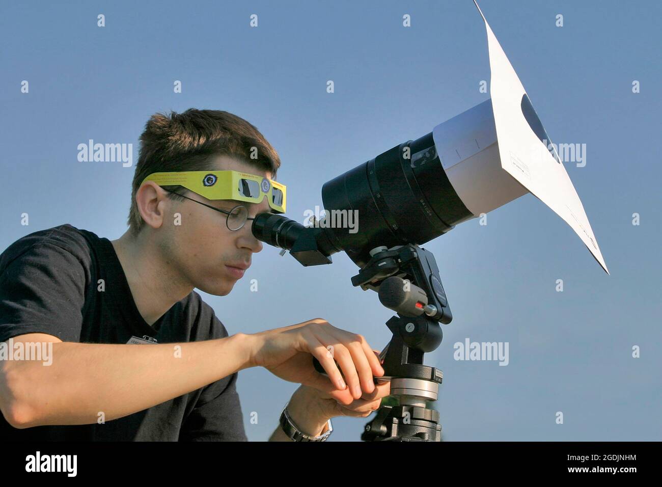 Man observing a solar eclipse with a telescope, Austria Stock Photo - Alamy
