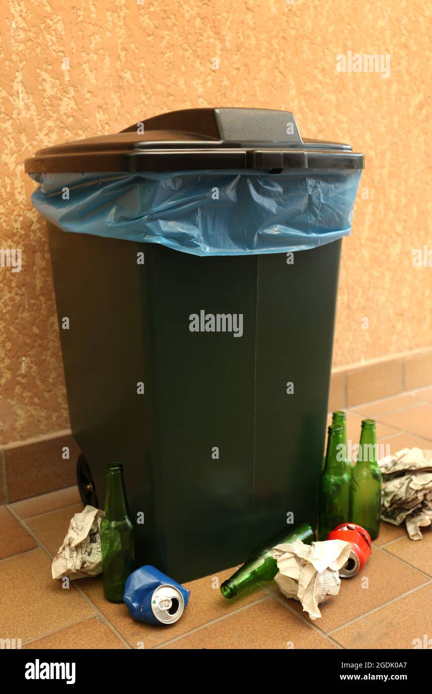 Recycling bin on wall background Stock Photo