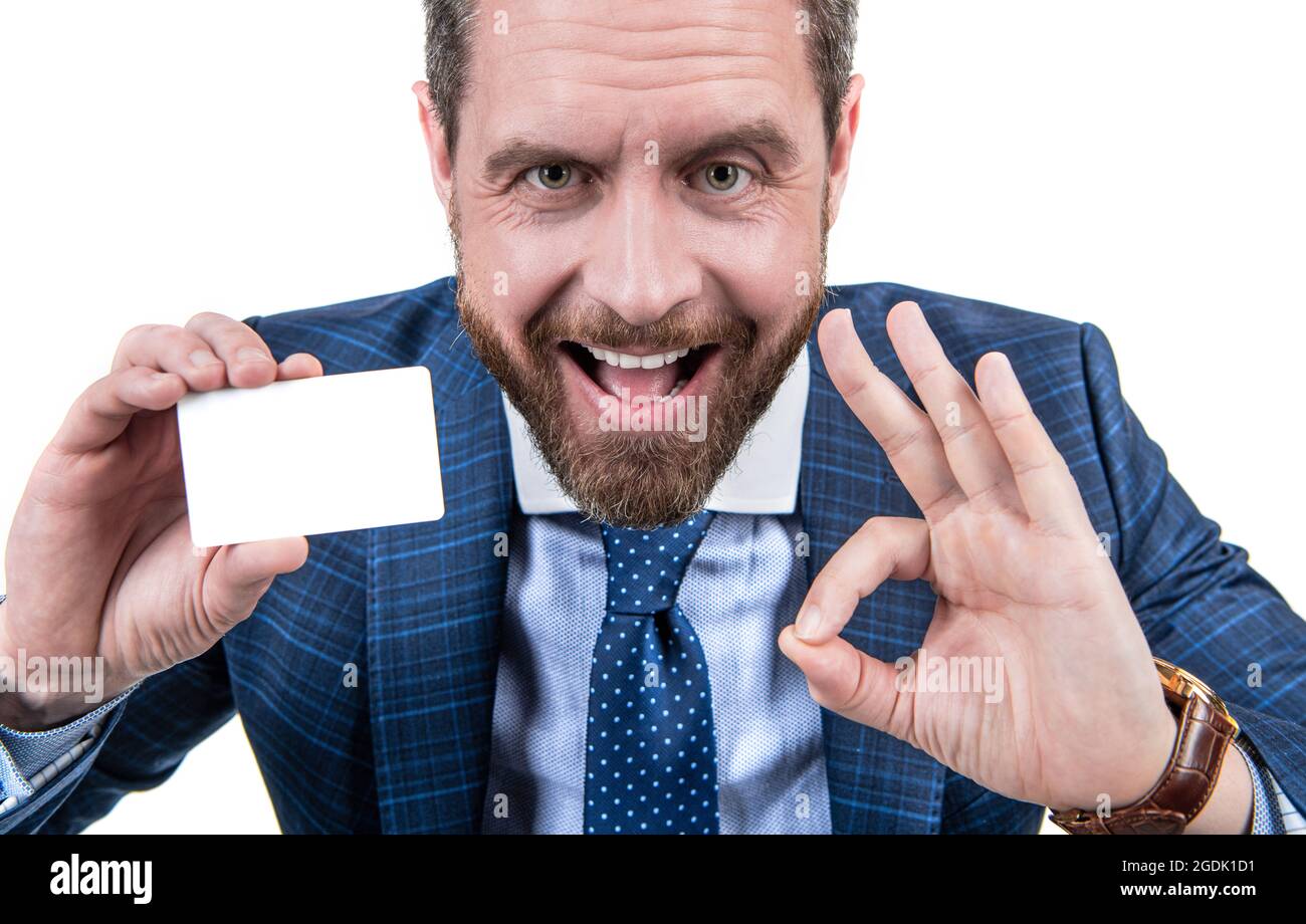 happy businessman man in businesslike suit showing empty debit or business card for copy space Stock Photo