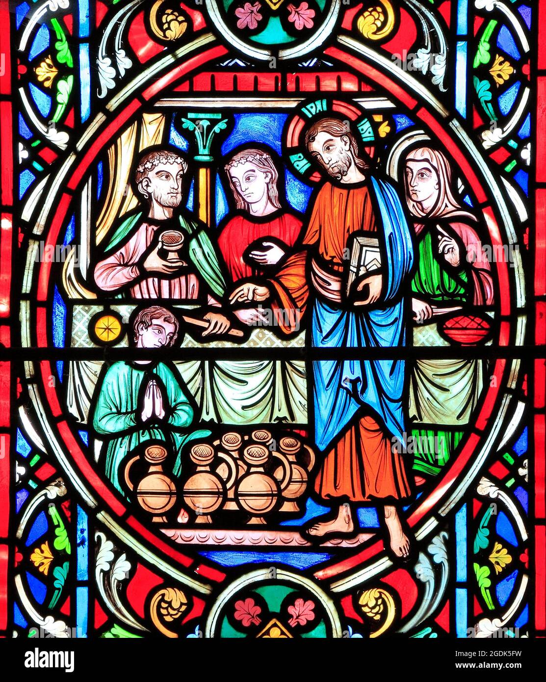 Scene from Life of Jesus, by Adolph Didron, Paris, 1860, stained glass window, Feltwell, Norfolk, Jesus at Cana Wedding Feast, turns water into wine. Stock Photo