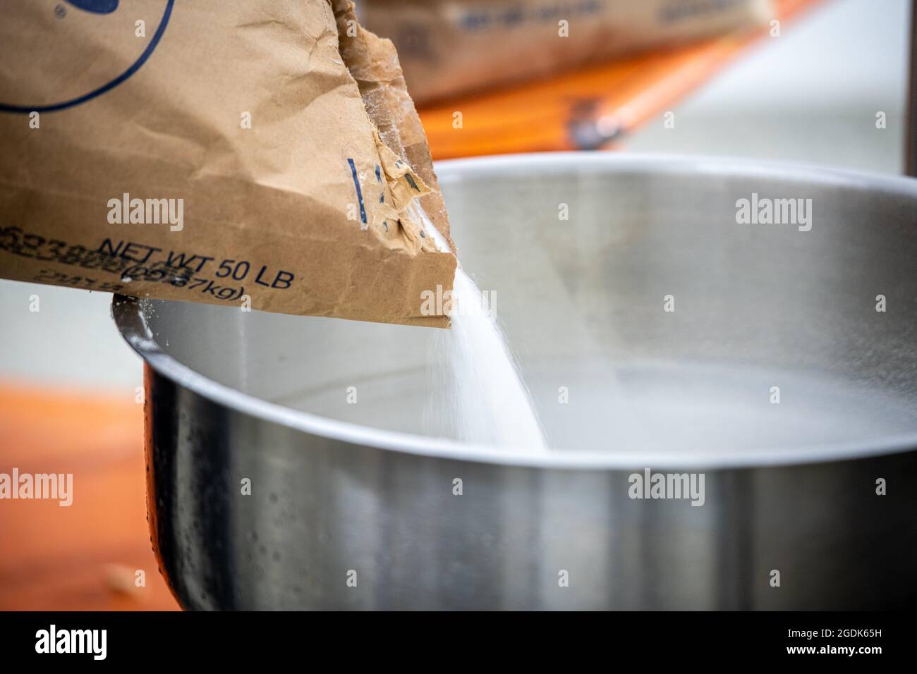 Milk solids being added during ice cream production Stock Photo Alamy