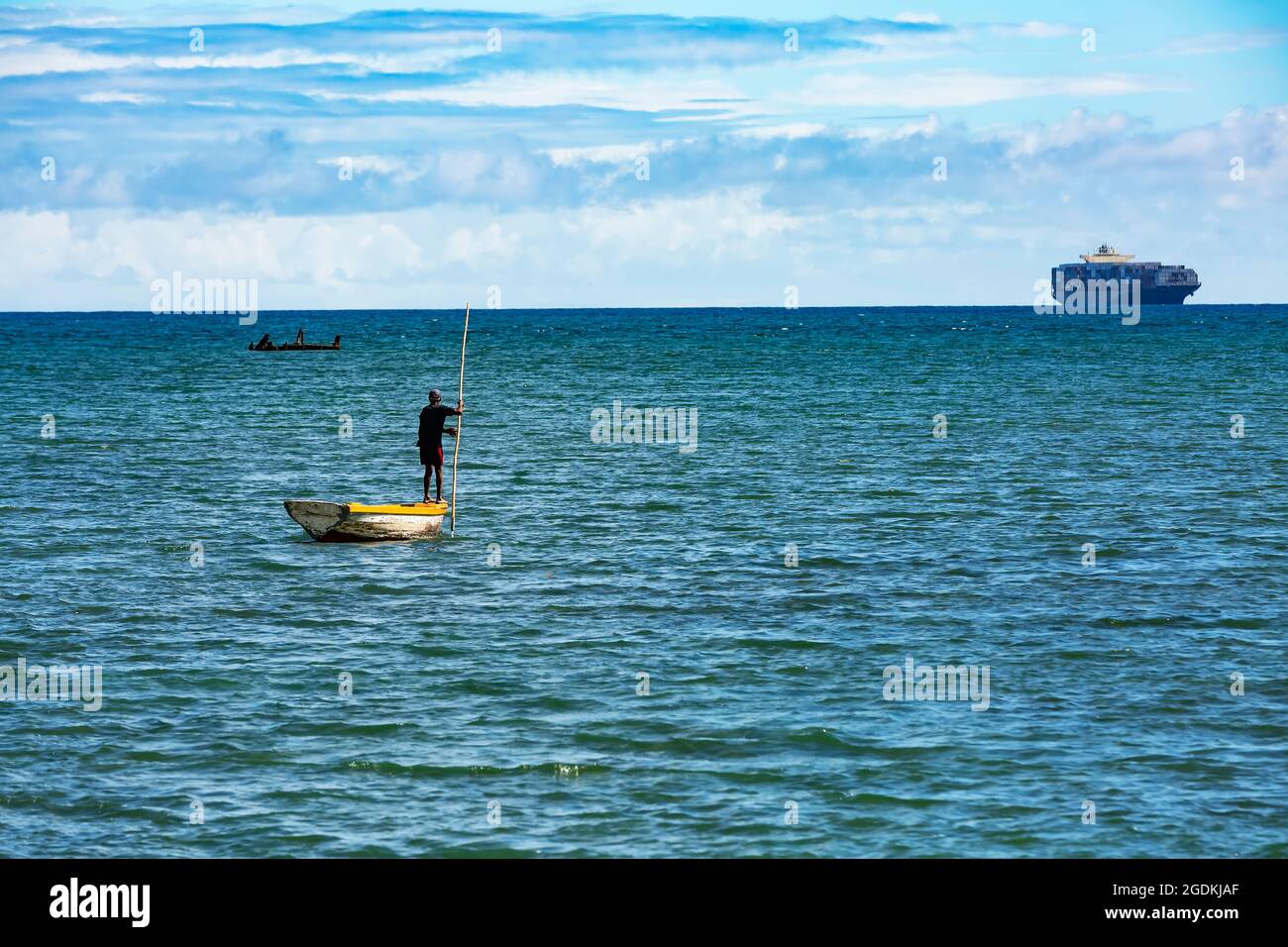 fisherman and his dinghy in the ocean Stock Photo Alamy