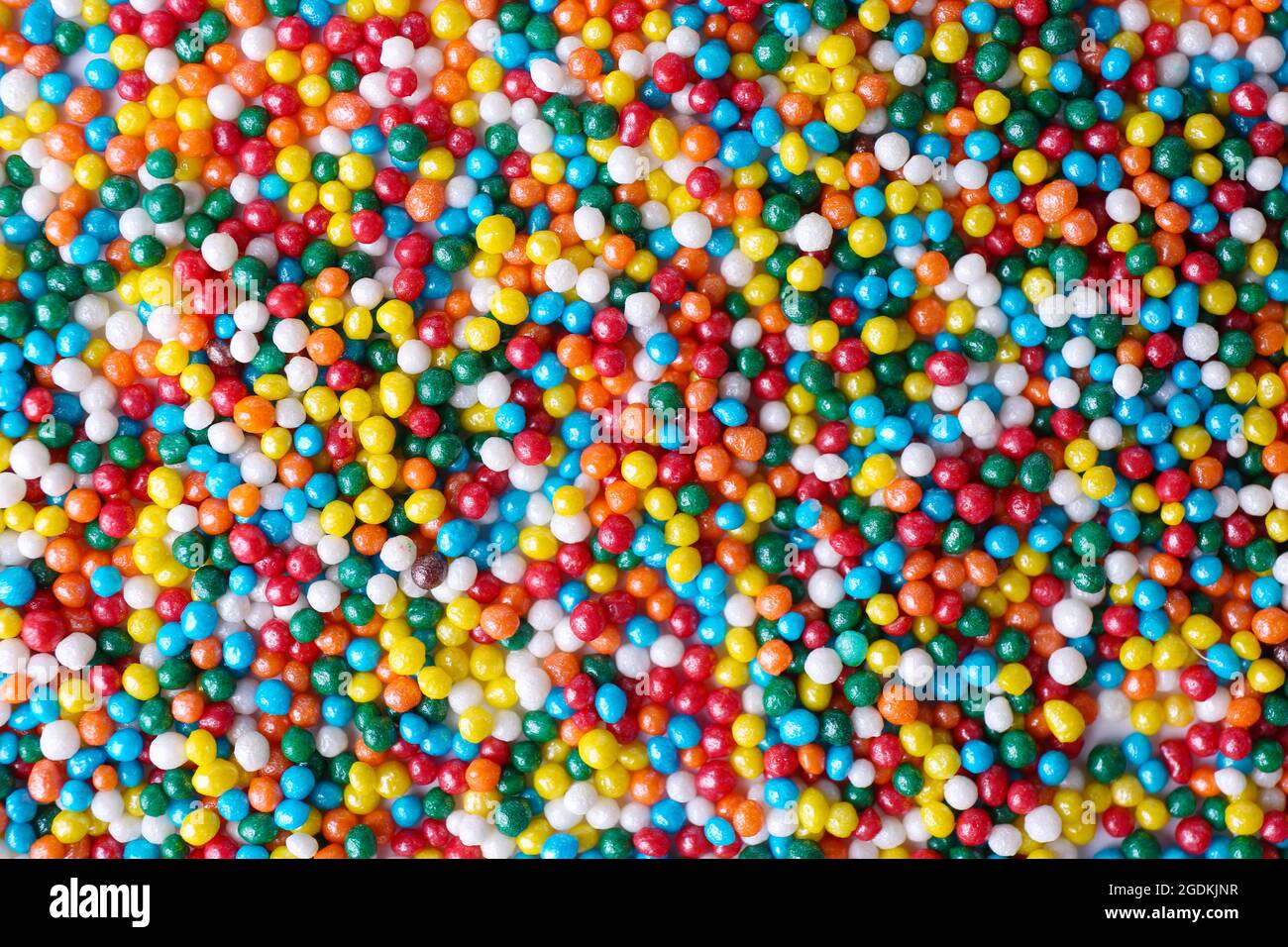 Colorful sugar sprinkles background Stock Photo - Alamy