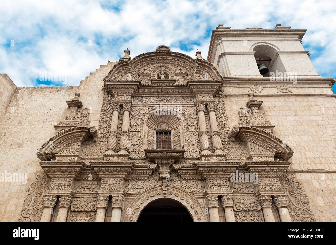 Jesuit monastery facade in indigenous baroque style made of white volcanic sillar stone, Arequipa, Peru. Stock Photo