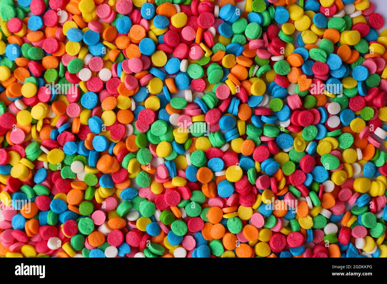 Colorful sugar sprinkles background Stock Photo - Alamy
