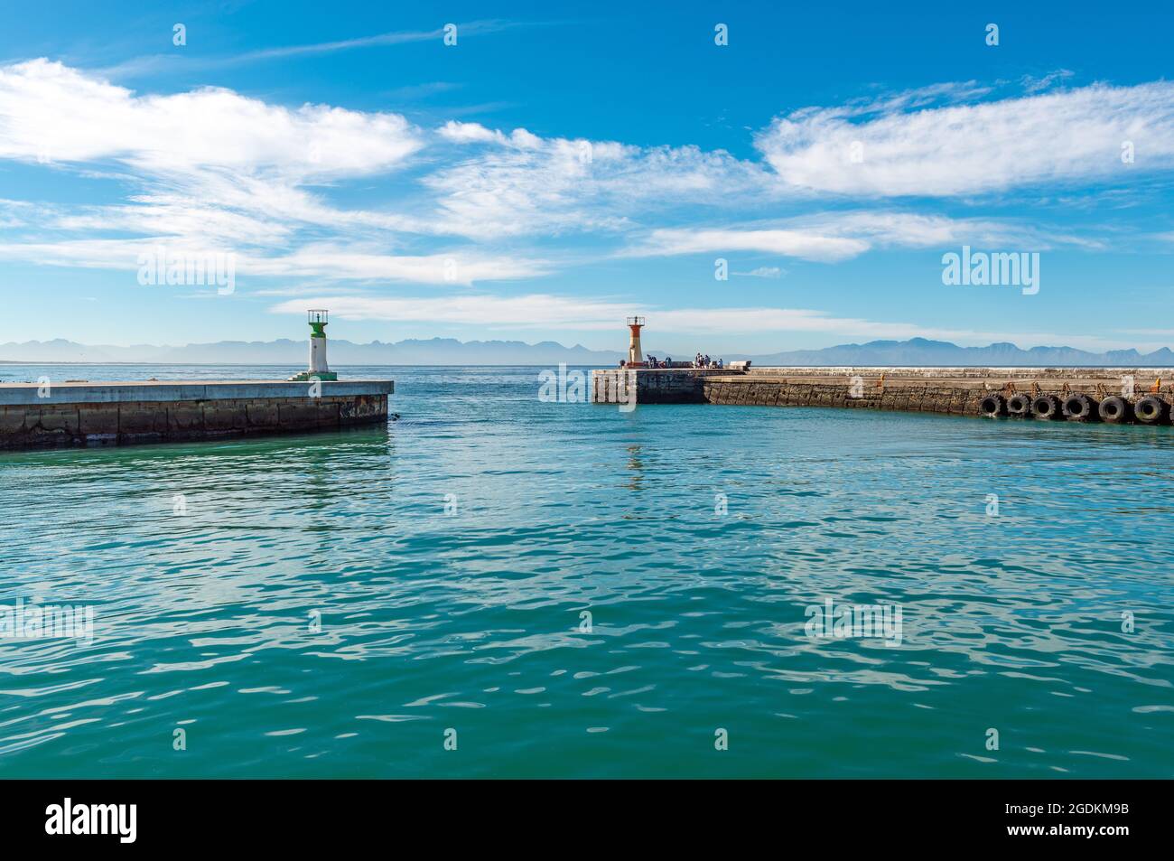 Piers with lighthouse in Kalk Bay harbor near Cape Town, South Africa. Stock Photo
