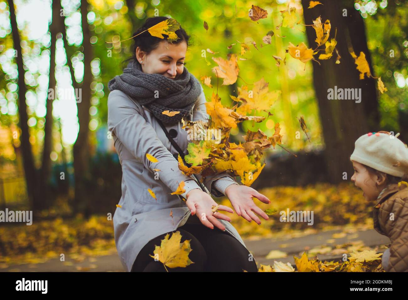 Young mother and her daughter have fun at autumn Stock Photo - Alamy