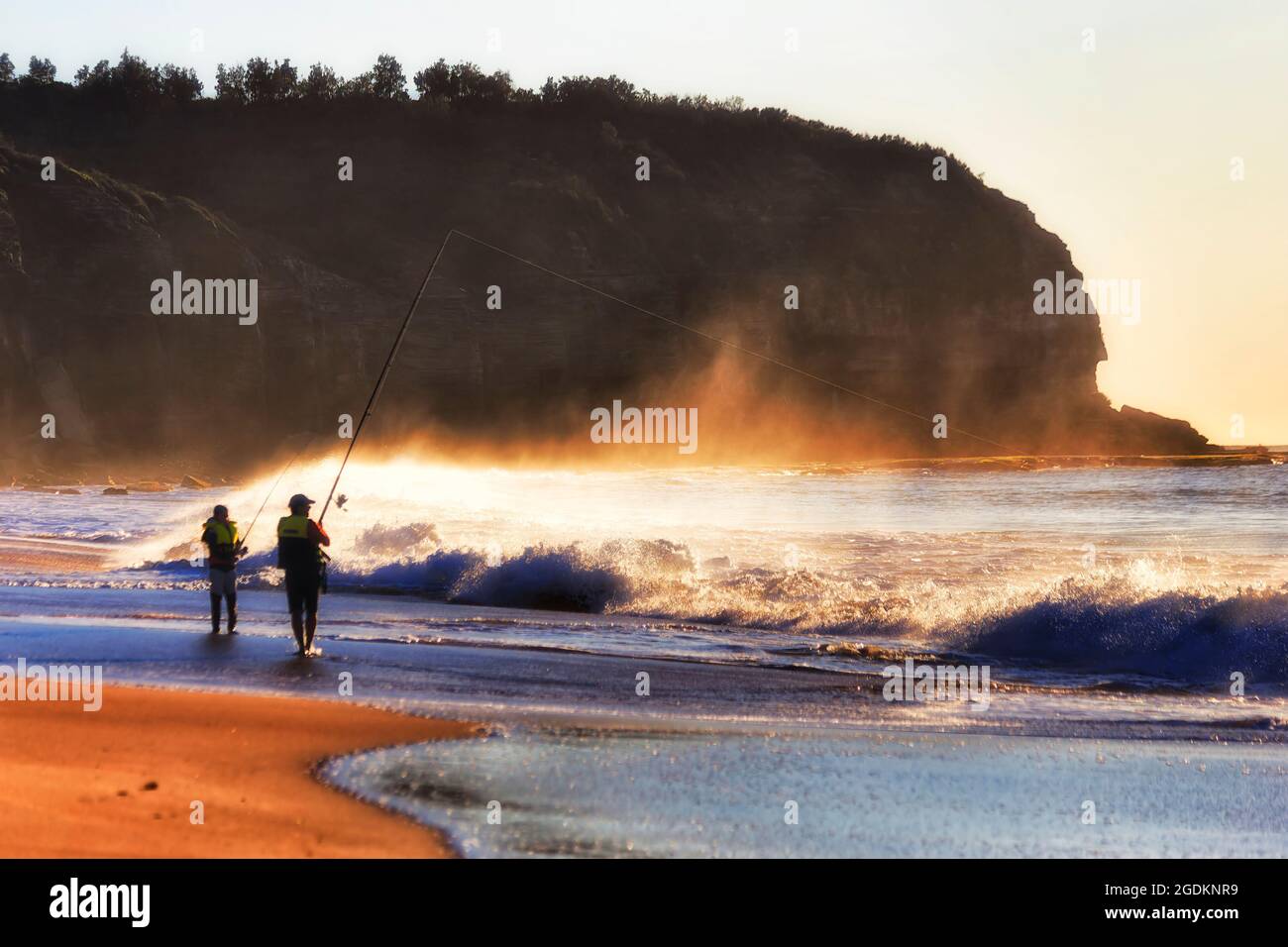 Recreational fly-fishing with rods and strings off Turimetta beach on Sydney Northern beaches - scenic sunrise. Stock Photo