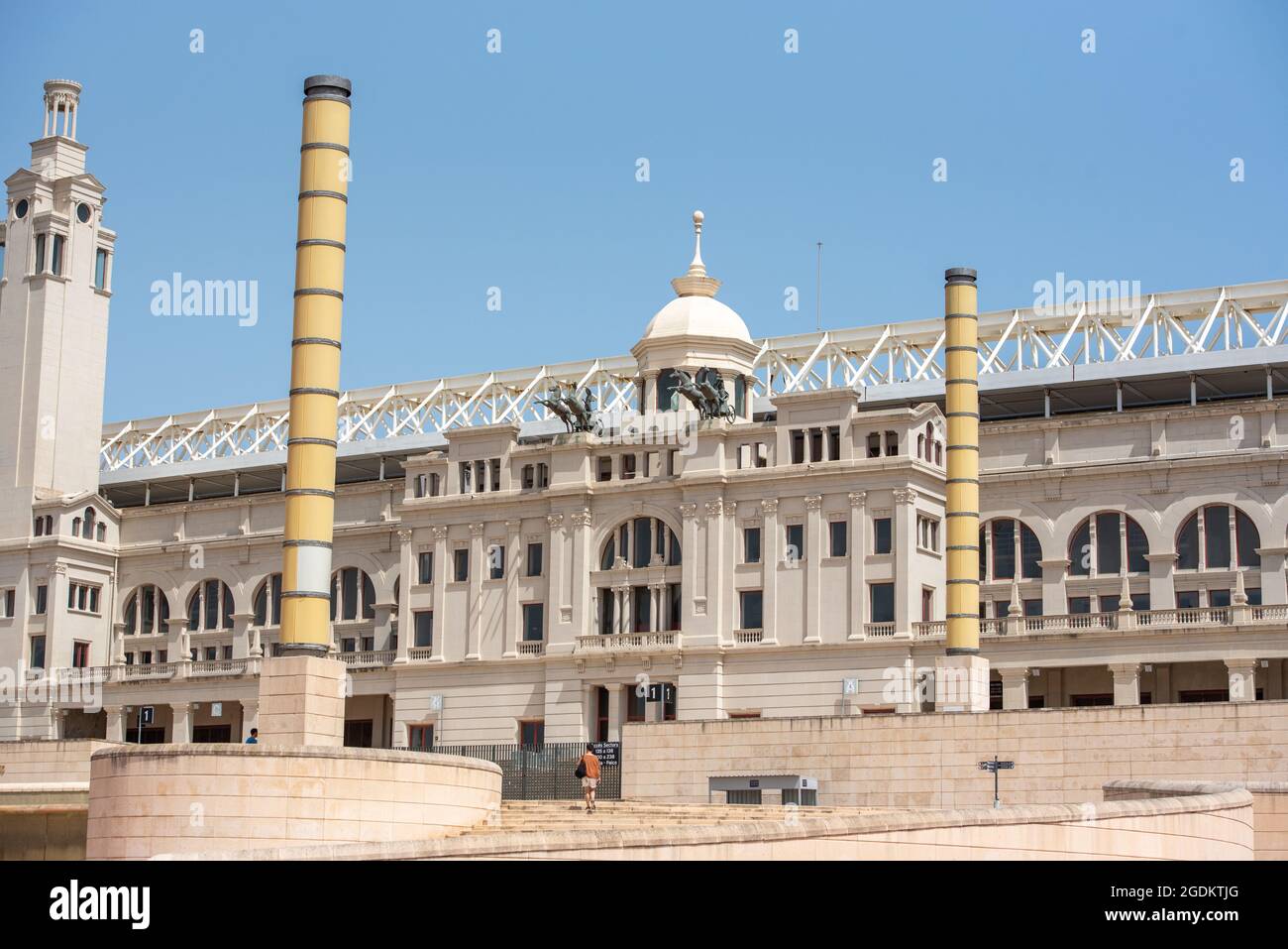 Barcelona, Spain; August 12 2021: Montjuic Olympic Stadium, built in 1927. Clock above empty tribunes on sport arena. Stock Photo