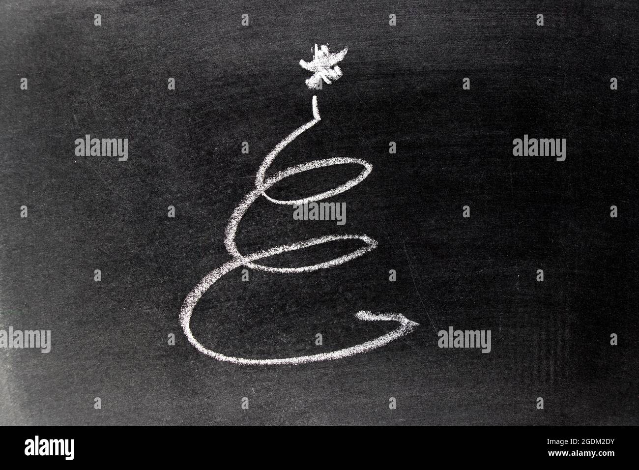 White chalk hand drawing in spiral or christmas tree in line shape on ...
