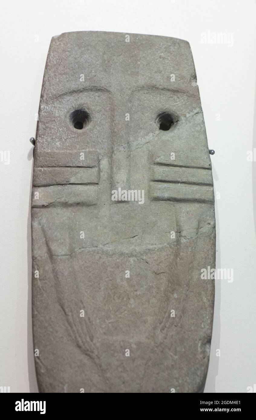 Madrid, Spain - Marh 6th 2021: Late Neolithic engraved slate plaque of Garrovillas de Alconetar. MAN Madrid Stock Photo