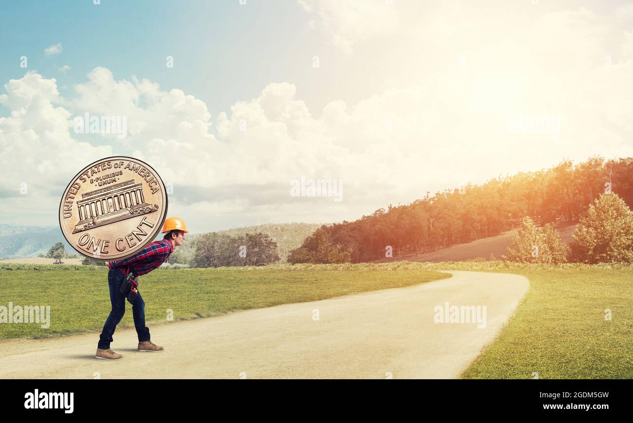 Builder man carry coin Stock Photo Alamy
