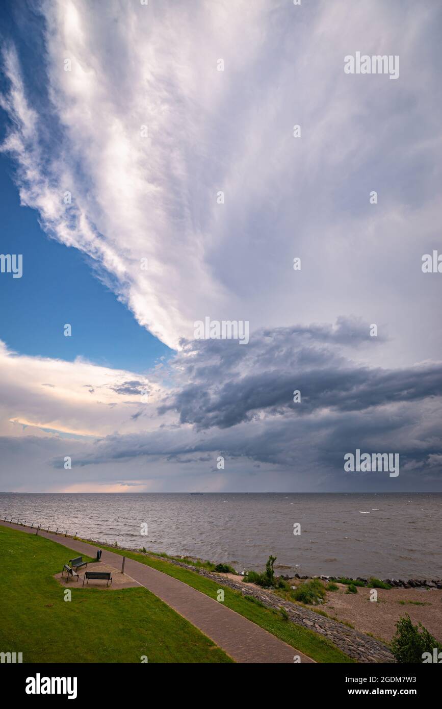 Large anvil of a thunderstorm over Lake IJsselmeer in Holland Stock Photo