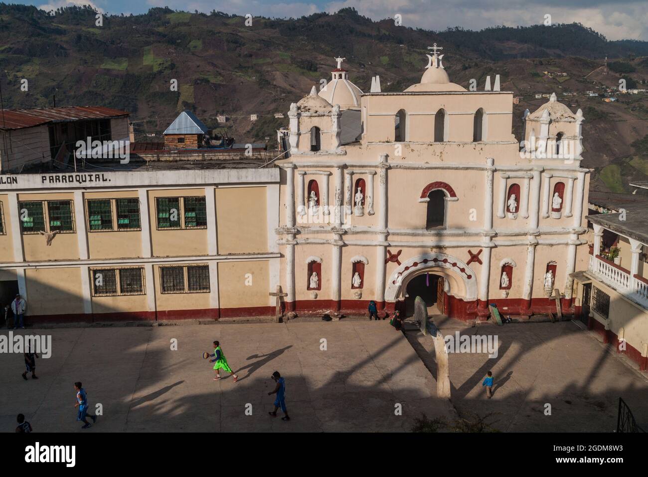 SAN MATEO IXTATAN, GUATEMALA, MARCH 18, 2016: View of a basketball field and a church in San Mateo Ixtatan village. Stock Photo