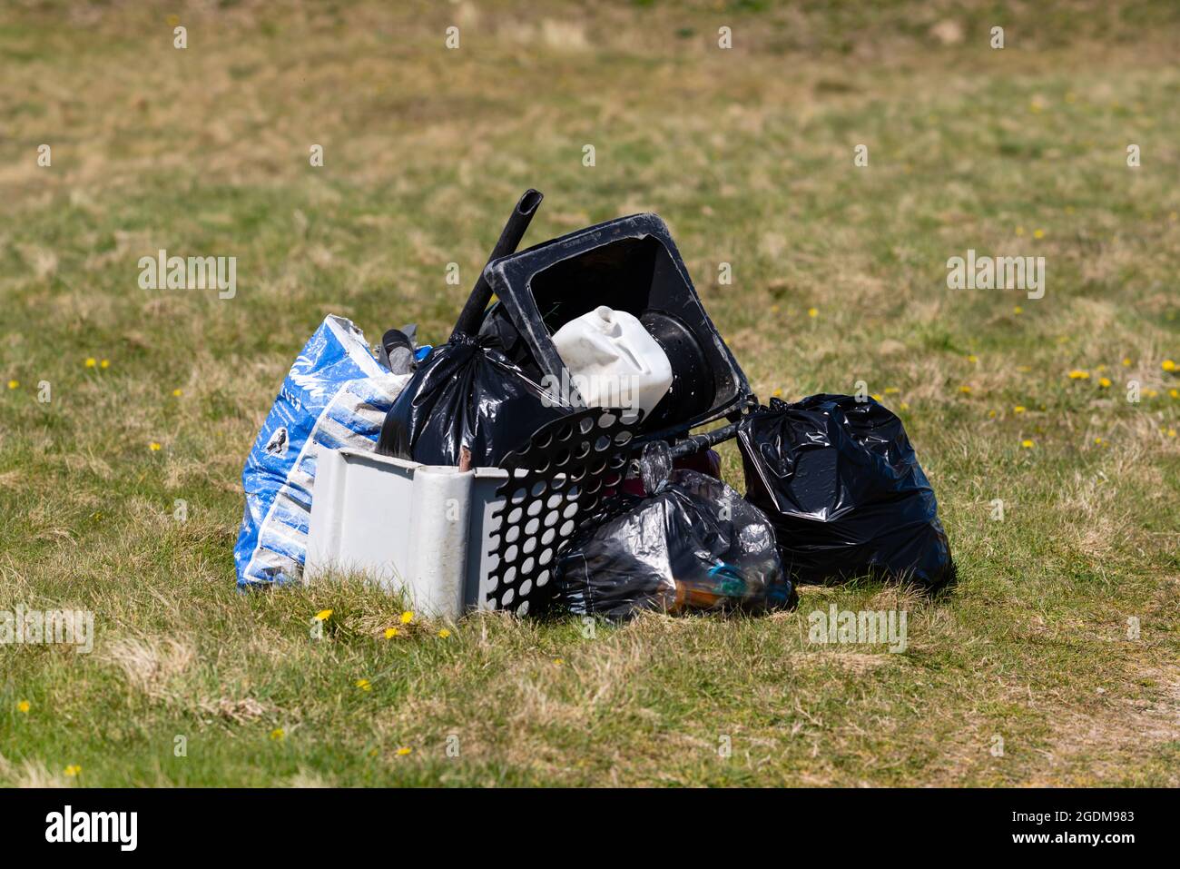 Rubbish collected by volunteers from the foreshore is left in a pile for collection Stock Photo