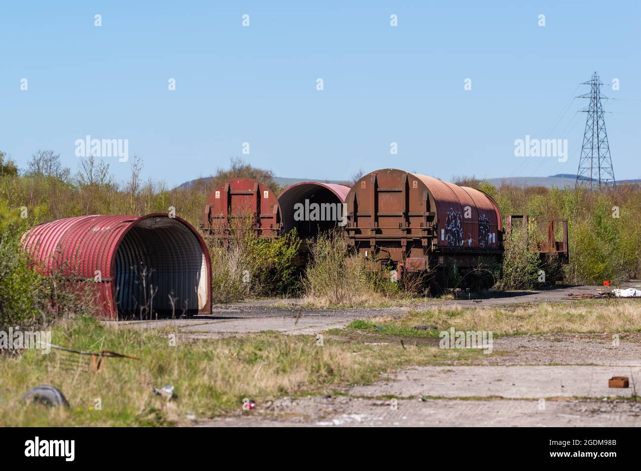 Disused railway wagons rusting in a disused siding Stock Photo