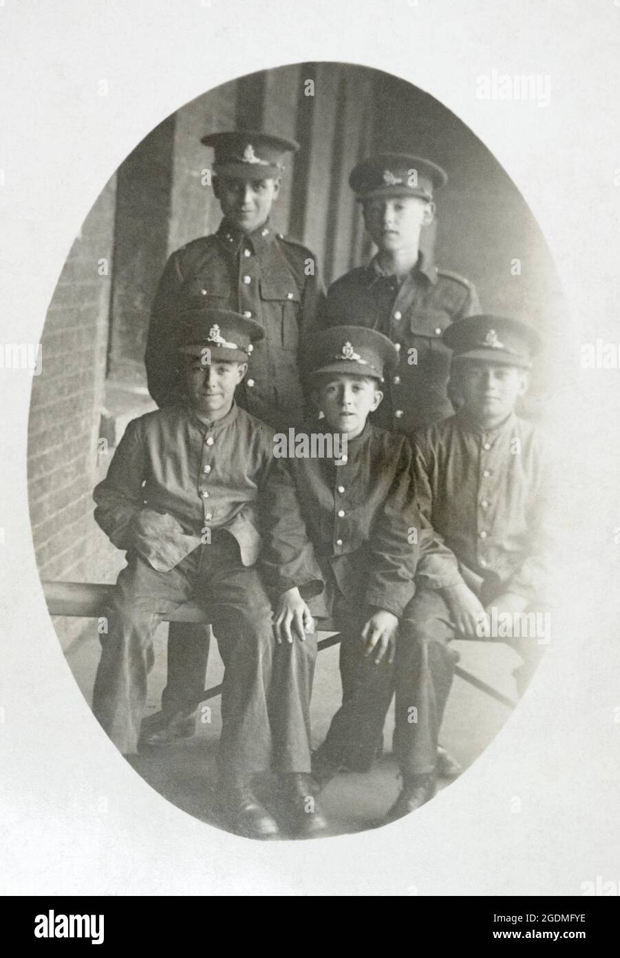A potrait of five British Army boy soldiers in the Royal Artillery. From early 20th centuary, possbily from the First World War. Boy could be recruited into the army at this time from the age of 14, often serving as buglers and musicians. Stock Photo