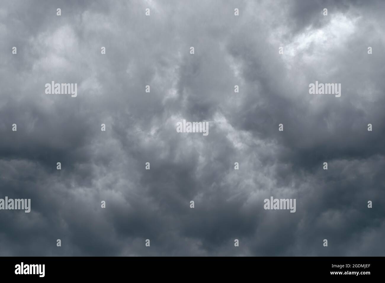 Dramatic sky background with dark storm clouds in dark sky. Black clouds before rainy. Stock Photo