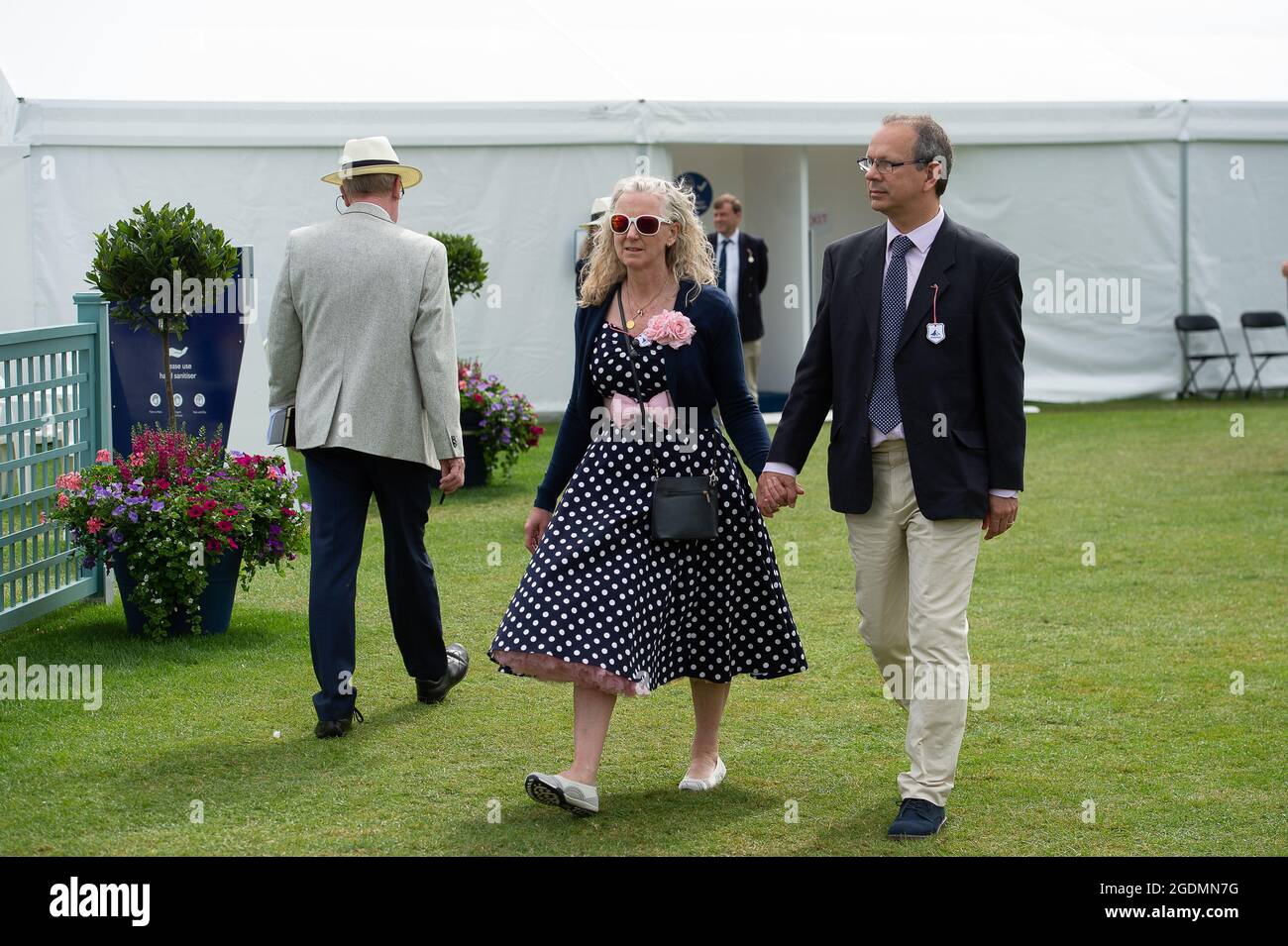 Henley, Oxfordshire, UK. 14th August, 2021. It was another busy day as  guests at Henley Royal Regatta enjoyed watching the rowing. The Dress Code  has been relaxed this year to allow ladies