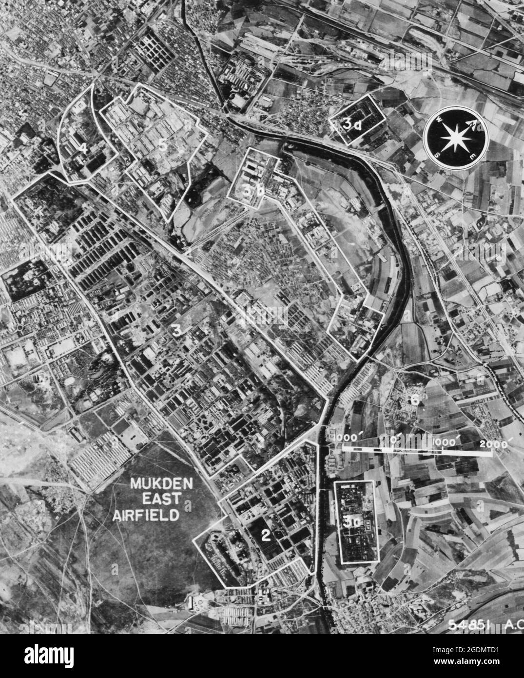East Mukden, Manchuria-(Photo taken on 14 June 44.) This area is near North Mukden airfield. Key: (1) AA battery, (2) Manchuria Airplane Mfg. Co.--A/C assembly, (3) Mukden arsenal, (3a and 3c) explosive storage and probable shell loading - World War II Stock Photo