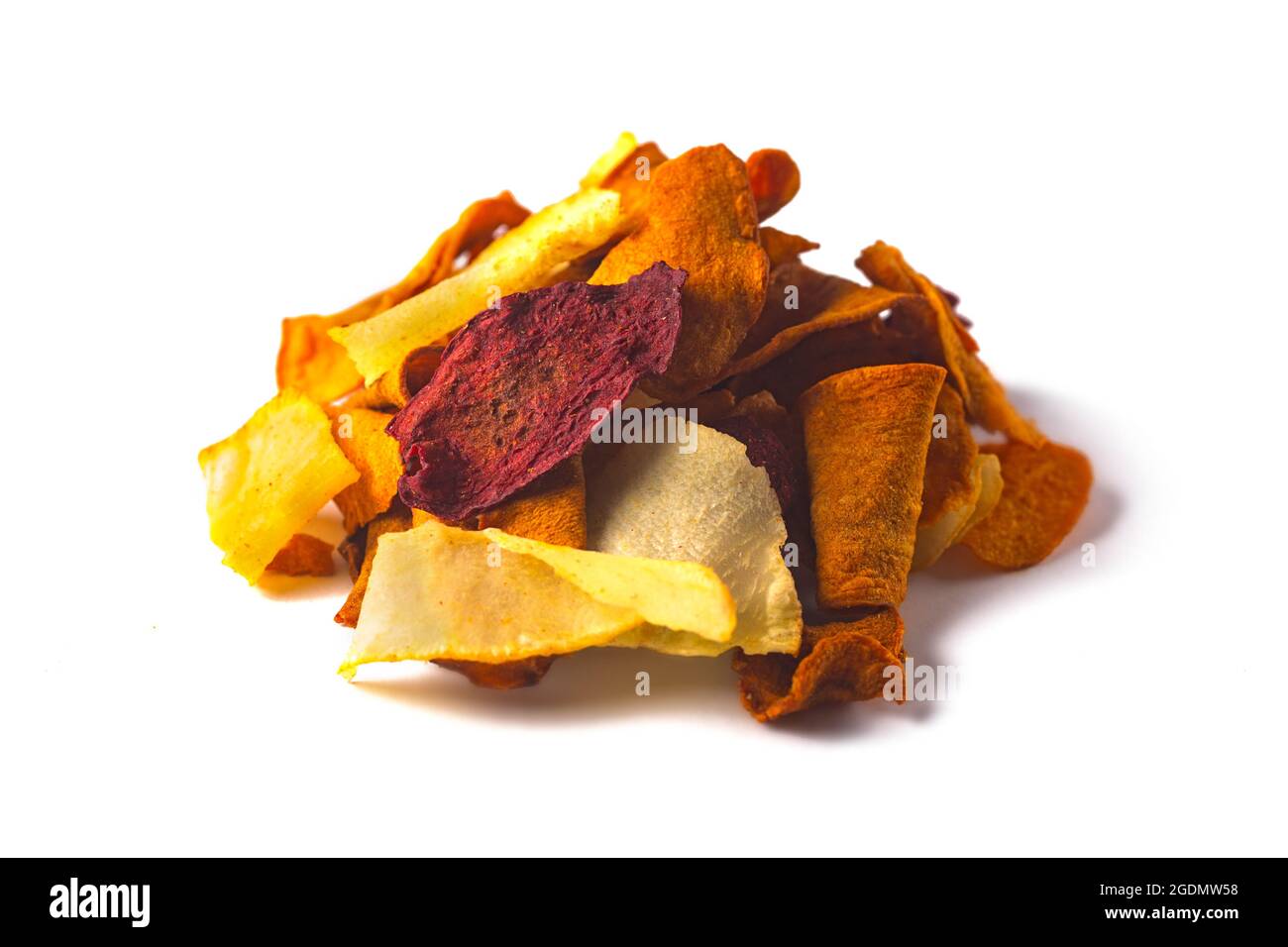 Stacked heap of vegetable dried potato, carrot and beet chips isolated
