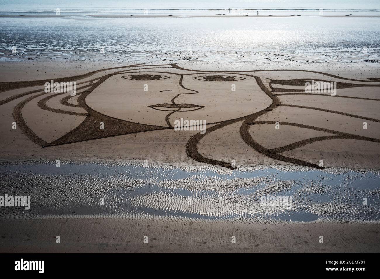 An enigmatic smile on Filey Beach, North Yorkshire, UK Stock Photo