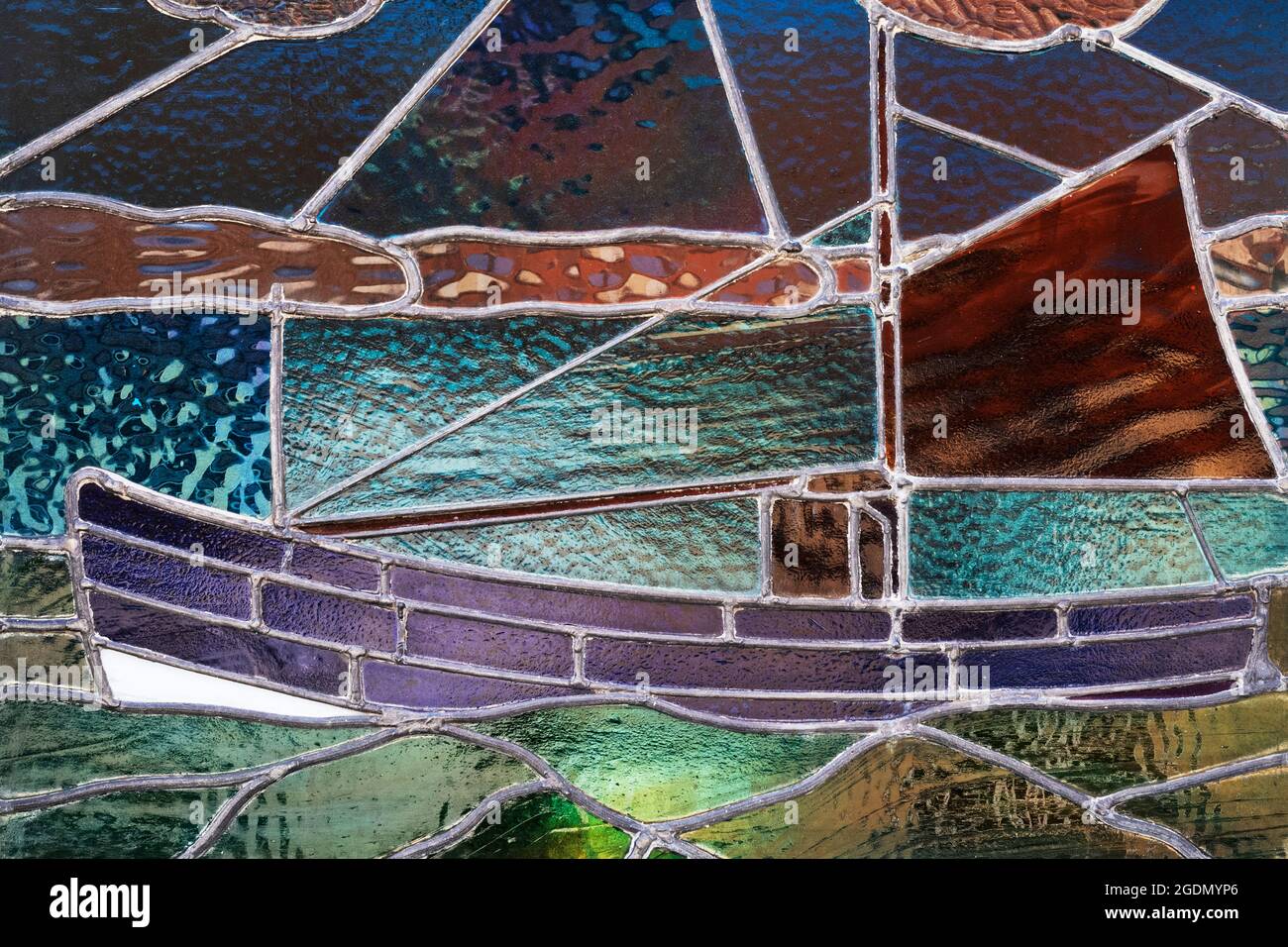 A traditional fishing Coble depicted in stained glass, Queen Street, Filey, North Yorkshire, UK Stock Photo