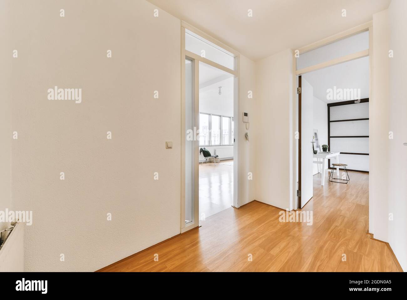 A long empty corridor designed in minimalistic style Stock Photo
