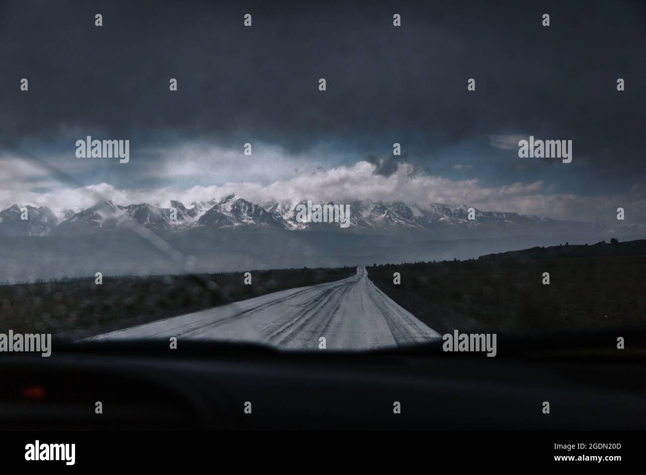 View of mountain peaks from the car window Stock Photo - Alamy