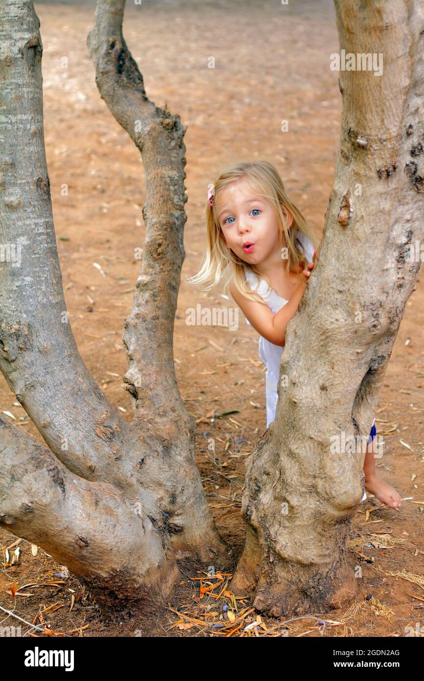 Girls playing hide and seek - Stock Image - F022/6980 - Science Photo  Library