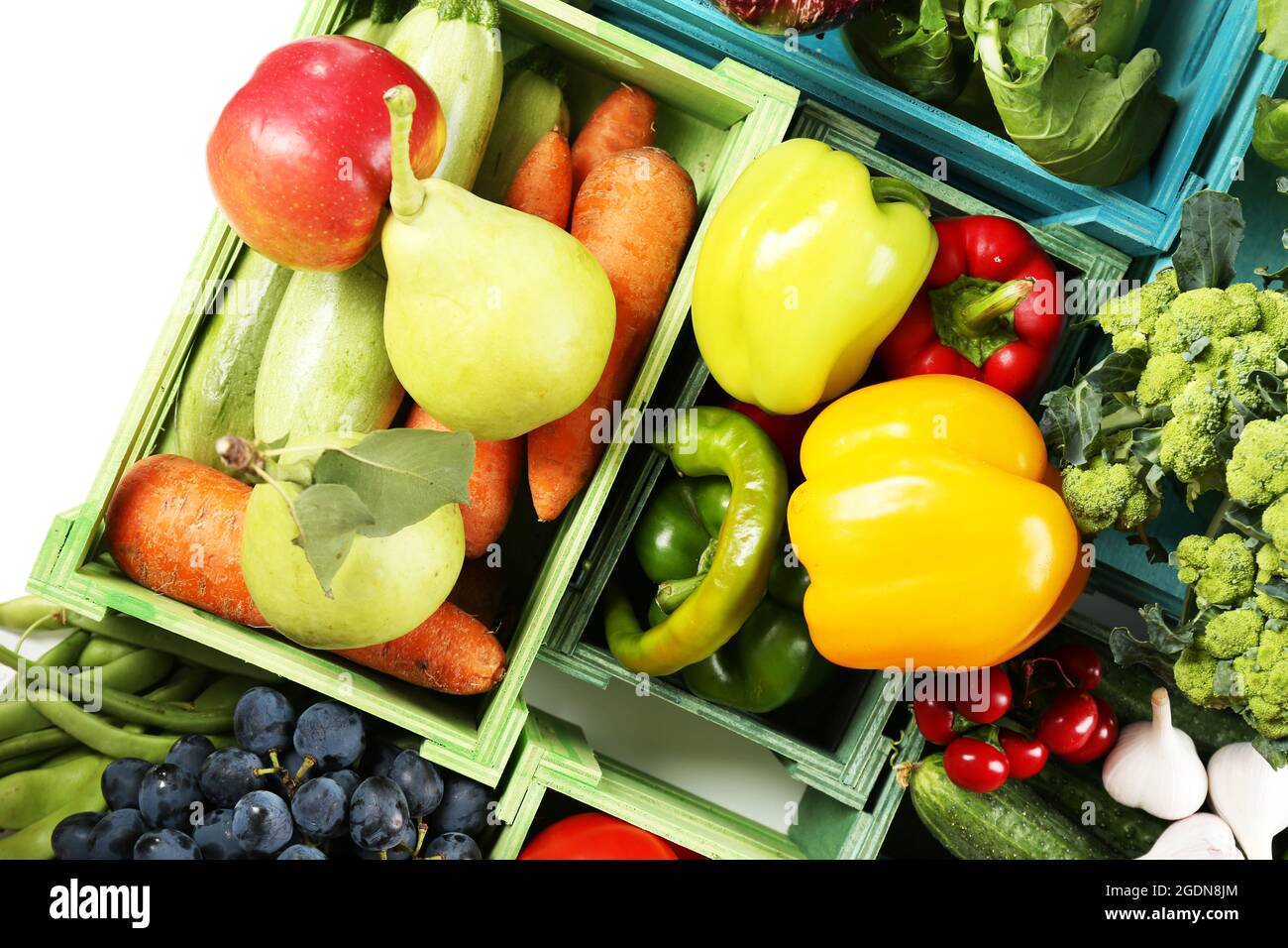 Fresh organic vegetables and fruits in wooden boxes, close up Stock ...