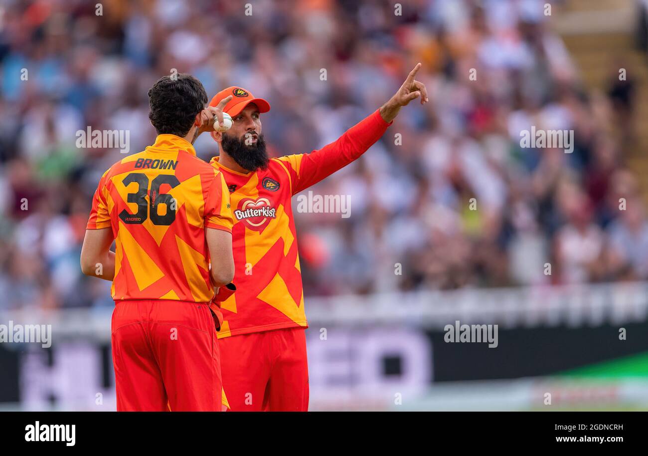 Pat Brown and Moeen Ali of Birmingham Phoenix in discussion against Oval Invincibles in The Hundred Stock Photo