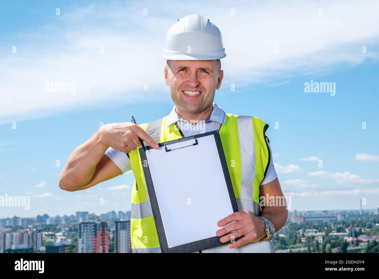 Filing Foreman Adult foreman showing blank document Stock Photo - Alamy