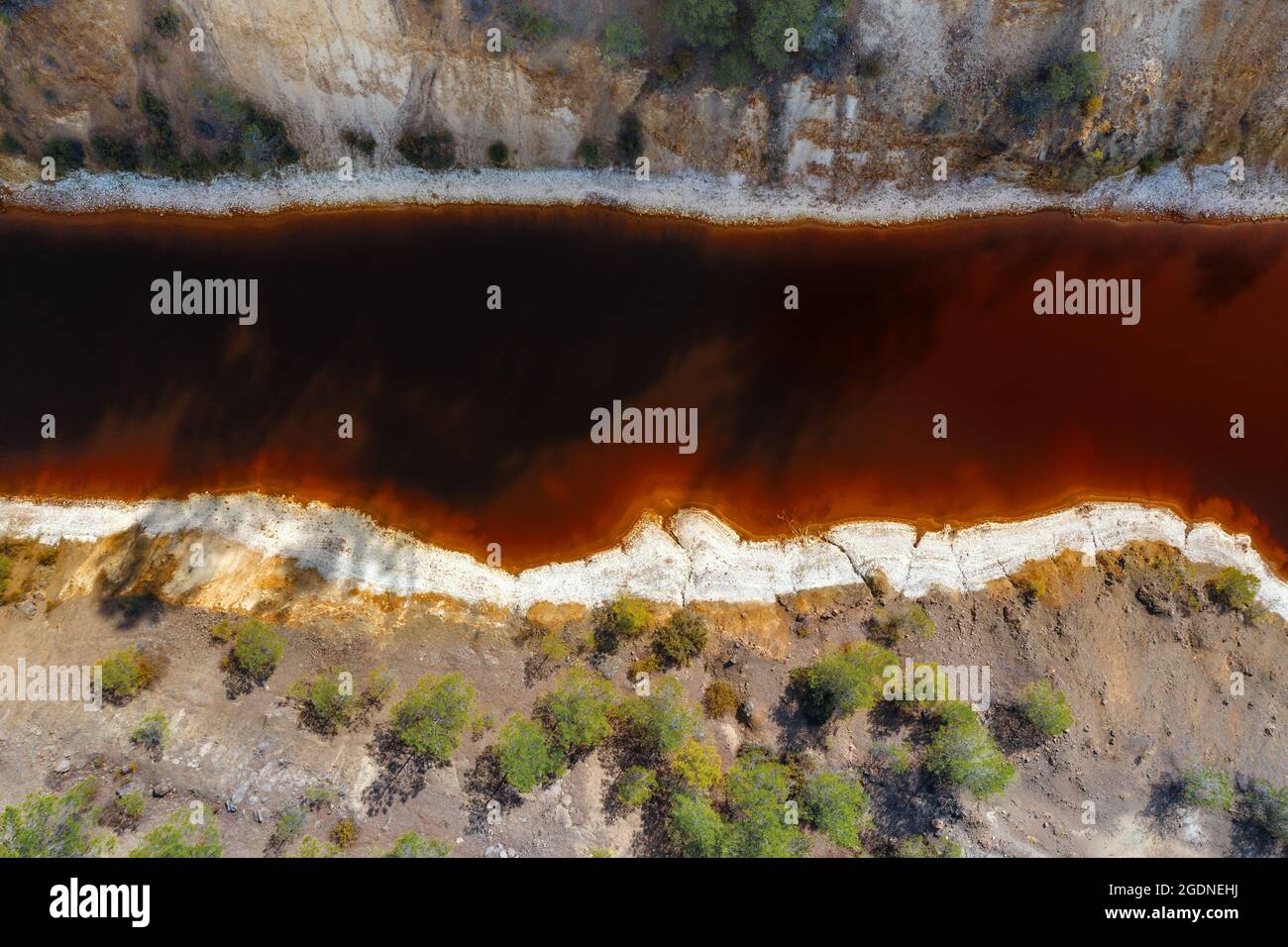 Acid mine drainage, toxic water in abandoned pyrite mine, aerial view directly above Stock Photo