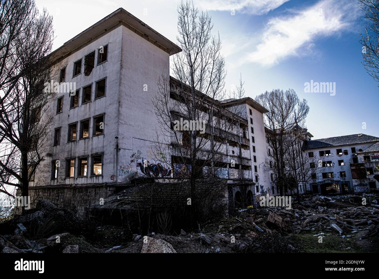 Interior and exterior of an old tuberculosis hospital located on a mountain  slope, made with granite stone, abandoned, looted, burned and very deterio  Stock Photo - Alamy, image size:1300x956