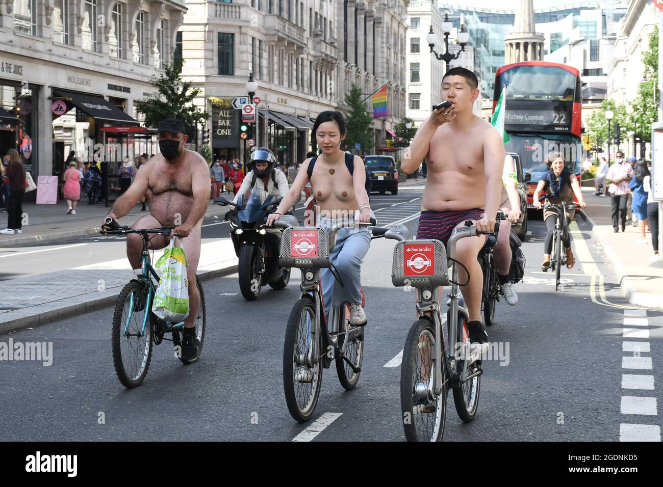 London, UK. 14h August 2021. Hundreds of naked cyclists took to the streets of London for the  annual World Naked Bike Ride. The global event was created in 2004 to protest against car culture and oil dependency, to highlight the vulnerability of cyclists, and a celebration of bicycles and the beauty of the human body and saving the planet. Credit:  Picture Capital/Alamy Live News Stock Photo