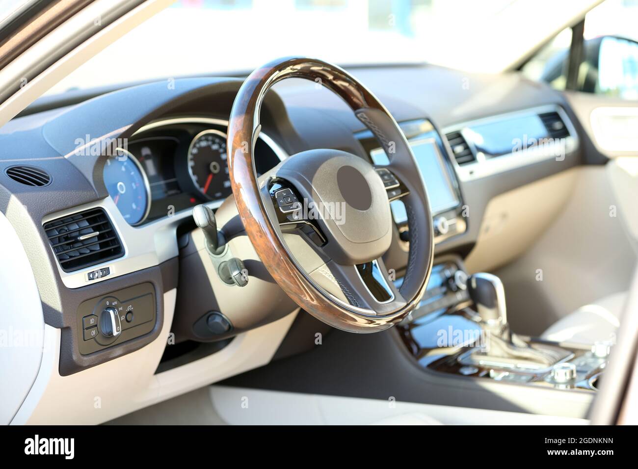 Interior view of car with beige salon and black dashboard Stock Photo